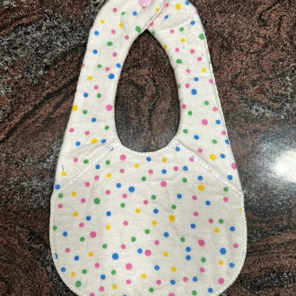 Handmade reversible quilted baby bib in pink deer print